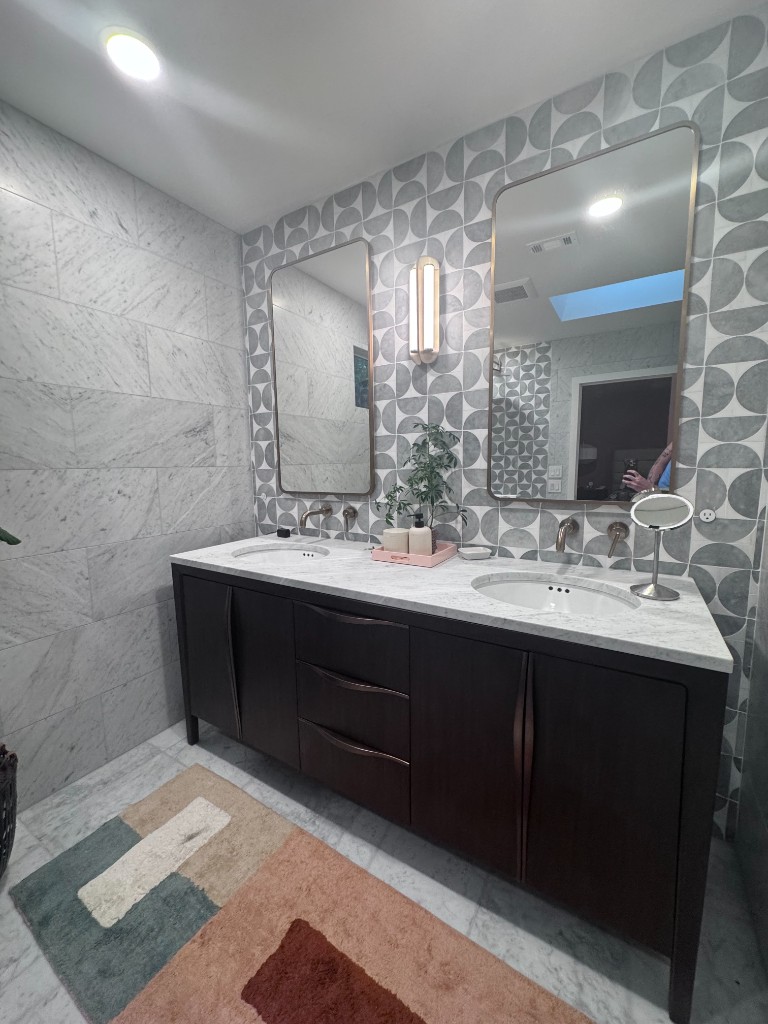 Bathroom stripped to plywood and exposed plumbing